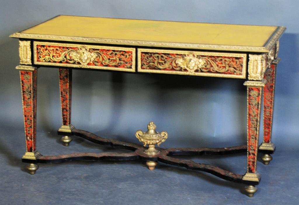 Antique Louis XV Style Boulle Leather Top Desk: Brass inlaid with leather top and 2 drawers. 31 1/2"H X 32"W X 26"D. Minor loses - otherwise in good condition. Some of the bronze mounts bear the mark "BF" on there reverse side. This mark is noted a