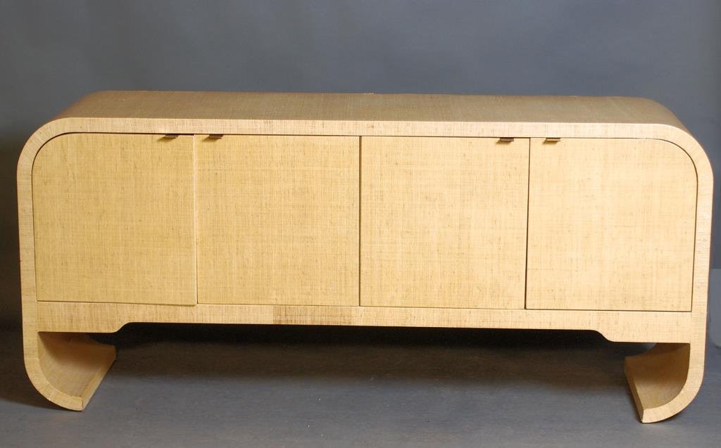 Karl Springer Design Sideboard: Grass cloth covered sideboard with 4 doors. 32 1/4"Hi X 72 1/4"W X 20"D. In good condition.