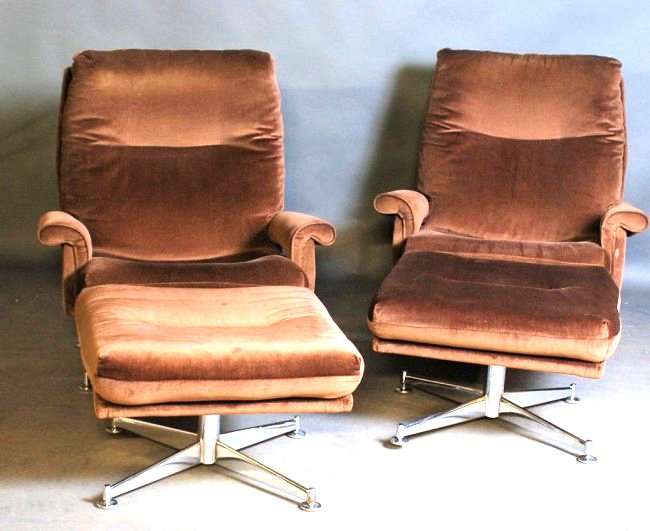 Pair of Milo Baughman Style Lounge Chairs: Brown low cut velvet with chrome bases. Includes matching ottoman. Chairs measure 37"H X 34"W X 36"D. Ottoman measures 16"H X 25"W X 25"D. In good condition.