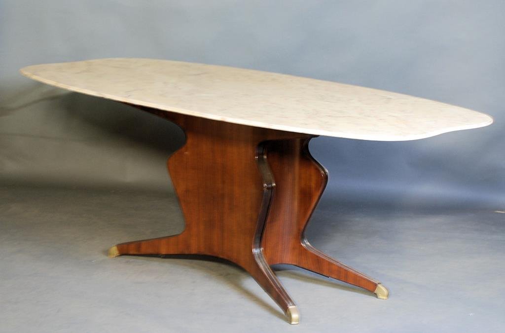 Osvaldo Borsani Dining Table: Original Osvaldo Borsani Italian marble top dining room table with rosewood veneer base and brass end caps. Circa 1950's. 30"H X 82"L X 38 1/2"W. In good condition.