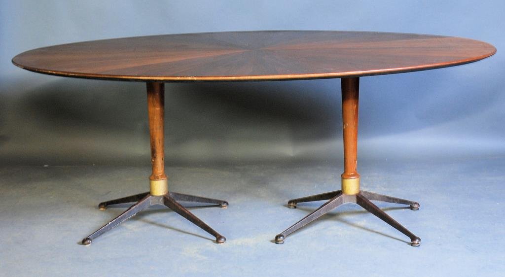 Gio Ponti Style Dining Room Table: Walnut oval table with sunburst design veneered on top. Rocket ship form iron and walnut column bases. 29 1/2"H X 78"L X 48"W. Surface scratches and wear consistent with age - otherwise in good condit