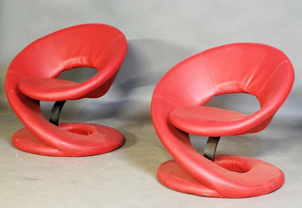 Pair of Italian Modern Snail Form Chairs: Red vinyl upholstery with metal spiral frames. 30"H X 31 1/2"W X 28"D. One chair has a split seam - otherwise in good condition.