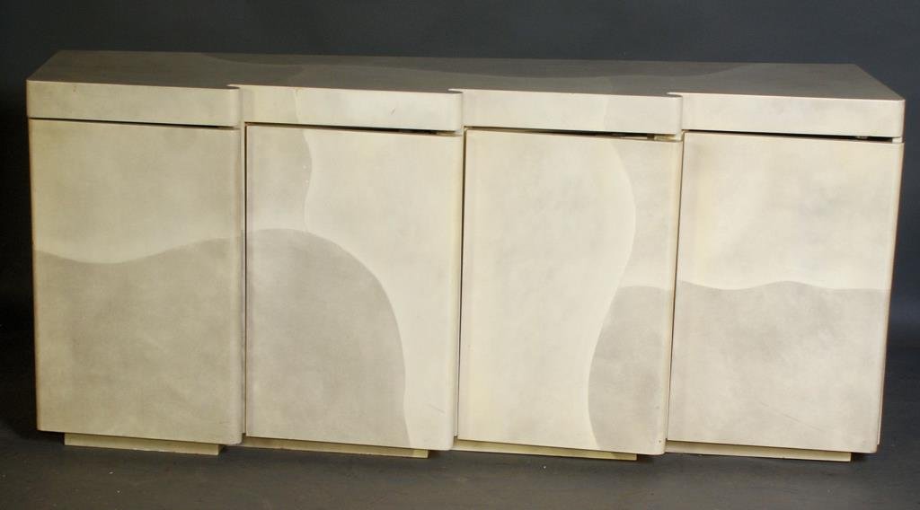 Karl Springer Style Sideboard: Parchment covered with serpentine front and 4 doors. 32 1/4"H X 72 1/2"W x 20"D. In good condition.