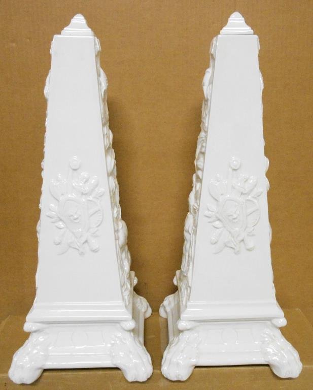Modern Italian Pottery Obelisks: Pair of mid century modern era Italian pottery 21” (h) x 8” (l) obelisks with Heraldic designs & finial top lids. Condition: 1 obelisk has chips on 1 foot & 3 chips on lid. Other obelisk is in ver