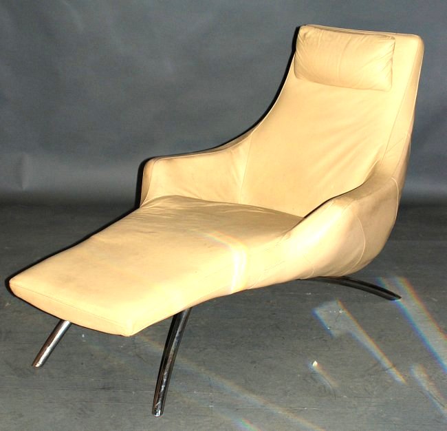 Modern Italian Chaise Lounge: Tan vinyl covering on a metal base. 36 1/2"H X 33"W X 59"D. Minor wear, otherwise good condition.