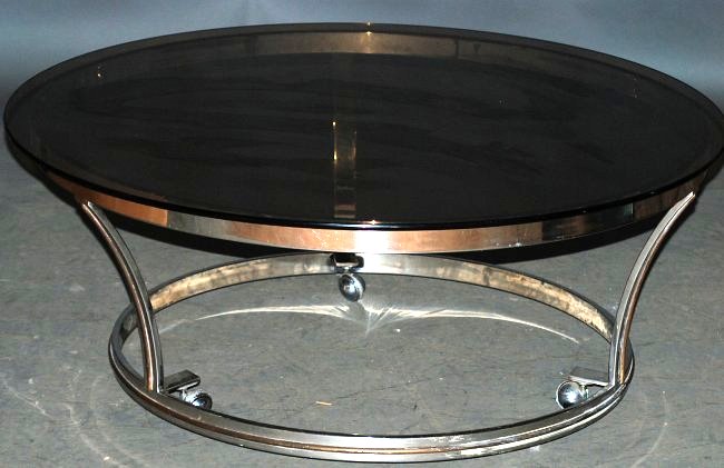 Pierre Cardin Coffee Table: Chrome with brass trim and smoked glass top. In good condition.