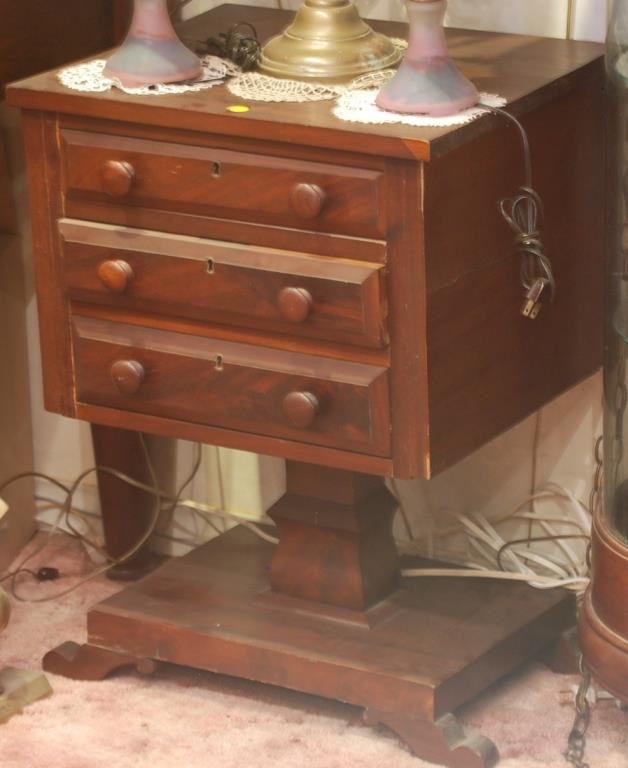 Antique American Empire Sewing Table: Antique American Empire Sewing Table Antique American Empire mahogany, 3 drawer sewing table. Dimensions: 20 1/2"W x 17 1/4"D x 28"H Condition: Wear is consistent with age and use.