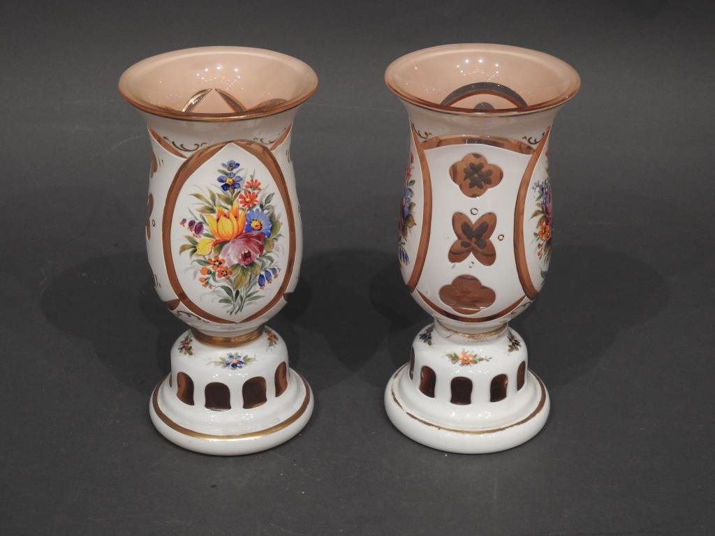 Pr. Vintage Bohemian Glass Vases: Pair of vintage white cased pink Bohemian glass Vases with hand painted floral designs, 8 1/4"H. Condition: Both are in very good condition with minor wear.