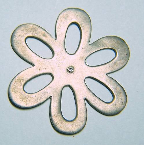 STEFAN BLAKE STERLING SILVER DIAMOND FLOWER PENDANT: pendant measures 1 11/16 inches flower shape, Weights 8.4 grams, it has a .05 ct white diamond, is marked Stefan Blake, In great condition