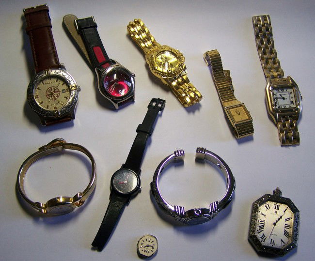 9 men woman wrist watch lot: 1 visage needs battery ladies,1 pl needs battery ladies, 1 domain needs back mens,1 nine west needs back, prada leather band ladies, 1 casio needs battery & band ladies, 1 amore monique needs battery