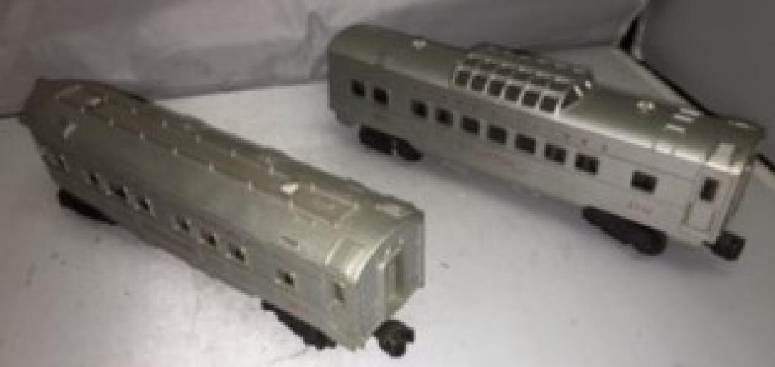 Lionel Postwar O Gauge Streamlined Passenger Cars: Two (2) Lionel Postwar O gauge passengercars. There is a 2432 Clifton vista dome car and a 2436 Mooseheart observation car. Very good condition with normal signs of use and age.