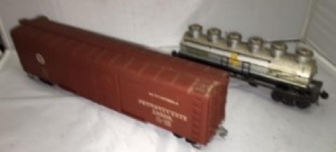 Metal O Scale Freight Cars: Two (2) metal (possibly brass) O scale freight cars. Pennsylvania automobile box car (one damaged truck) and North American 6-dome wine car. Kaydee couplers. Very good condition with normaal signs of