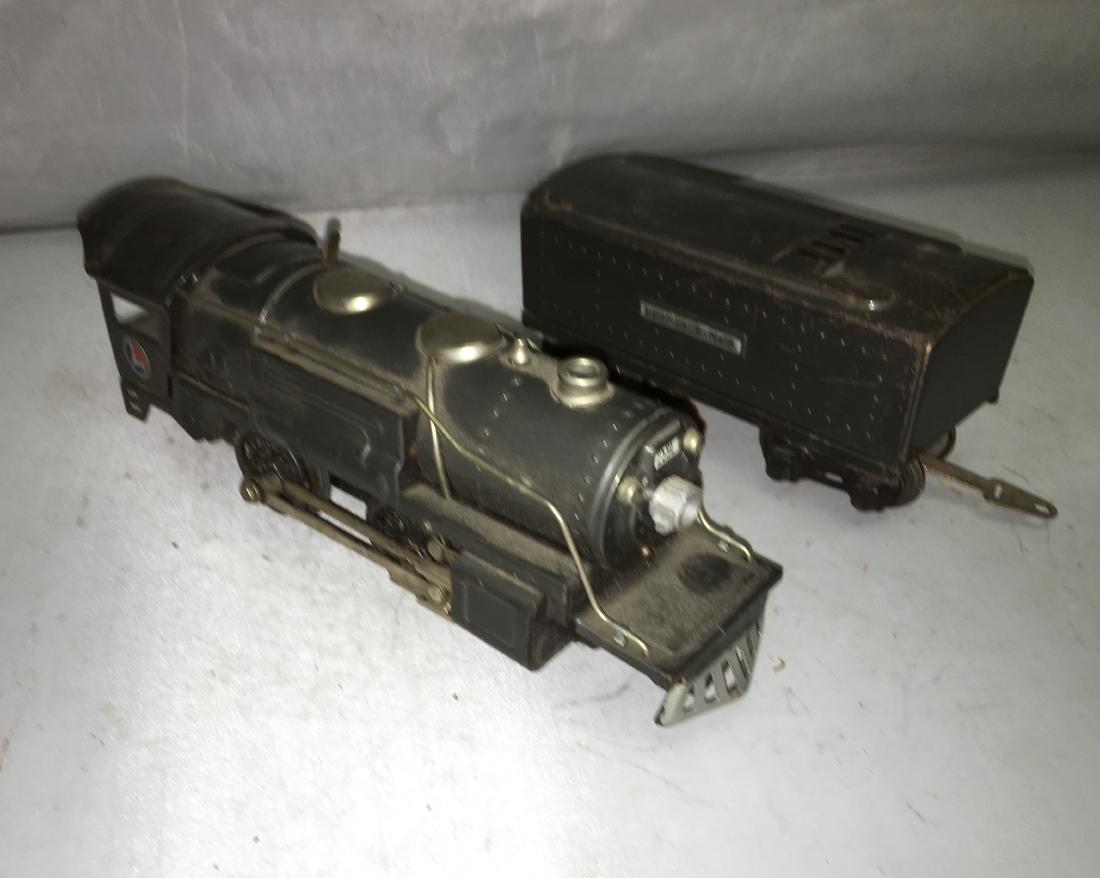Lionel :Prewar 259E O Gauge Gunmetal Steam Engine and: Lionel Prewar 259E O gauge gunmetal 2-4-2 steam engine with a 2689WX tender. Powered, whistle, lighted, metal construction. Very good condition with normal signs of use and age.