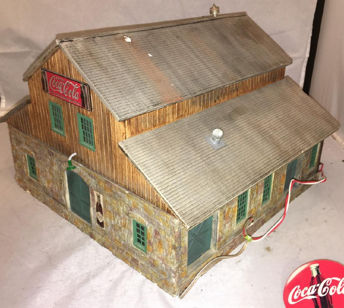 Cast Plaster O Gauge Coca Cola Plant: Coca Cola O gauge bottling plant. Cast plaster construction, lighted, about 12 inches by 10 inches. Some loose detail parts.