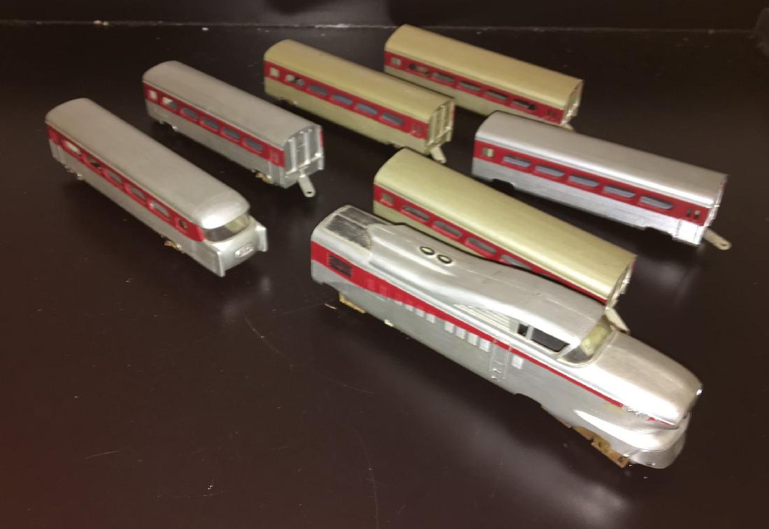 Varney HO Scale Aero Train: Varney HO scale Aerotrain. Power unit, end unit, 5 coaches. Brass wheels (a few are missing), metal frames.