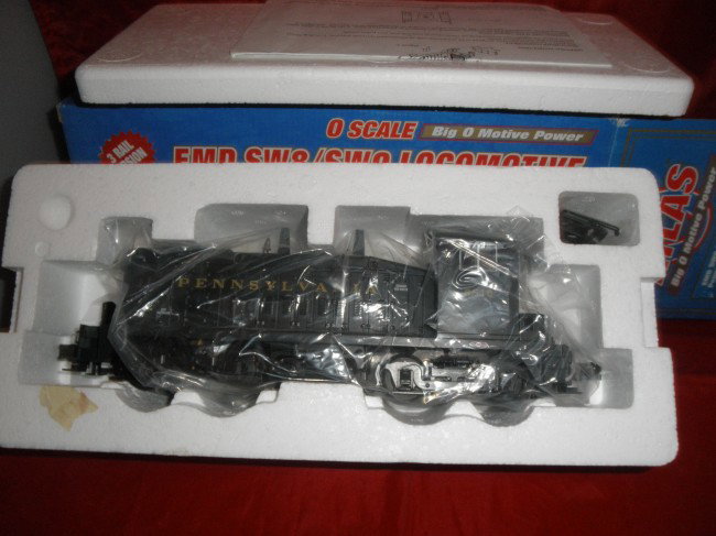 ATLAS PRR O GAUGE SW9 DIESEL ENGINE OB: Atlas Pennsylvania O gauge SW9 diesel engine in the original box with paperwork. Powered with other very nice features.