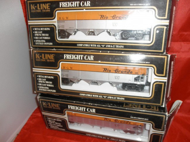 THREE K-LINE RG O GAUGE DIE CAST HOPPER CARS OB: Three (3) K-Line Rio Grande O gauge die cast hopper cars in the original boxes.