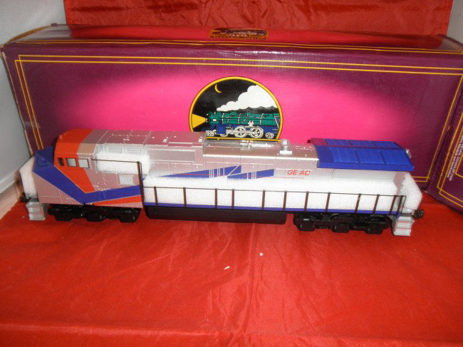 MTH PREMIER DEMO O GAUGE DASH-9 DIESEL ENGINE OB: MTH Premier #20-2160-1 GE Demo O gauge Dash-9 diesel engine in the original box with ProtoSounds.