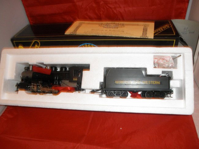 WEAVER GOLD BRASS B&O O GAUGE 0-6-0 STEAM ENGINE: Weaver Gold Edition Brass Baltimore and Ohio O gauge 0-6-0 steam engine and tender in the original box. Powered, smoke, and other very nice features. Decaled for Norfolk and Western.