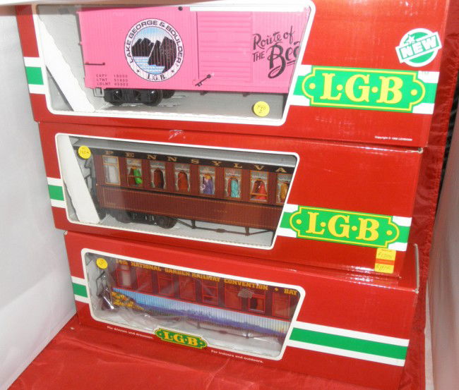 THREE LGB G SCALE TRAIN CARS OB/S: Three (3) LGB G gauge train cars in the original boxes with sleeves. #4090 Lake George box car, #3080 E01 Pennsylvania passenger car, #30808 HNSJ passenger car.