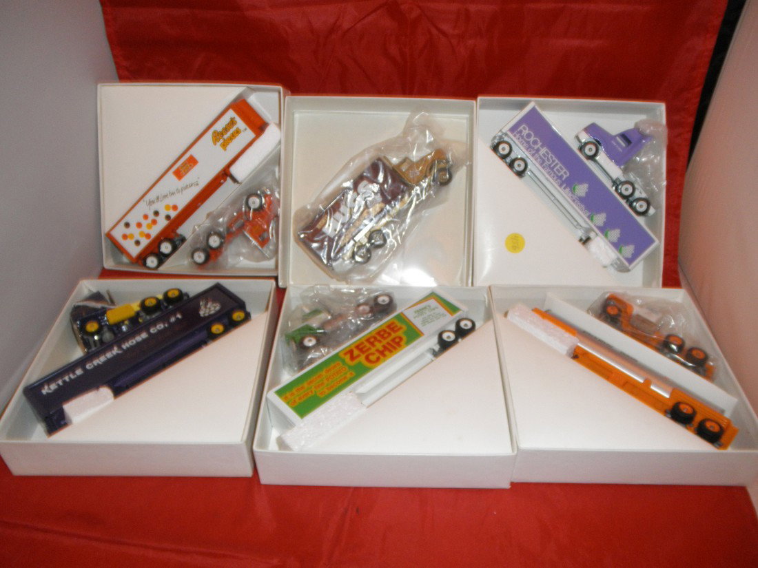 6 WINROSS 1/64 SCALE TRUCKS: Six (6) Winross metal 1/64 scale trucks in the original boxes, including Hershey trucks and a tank truck.