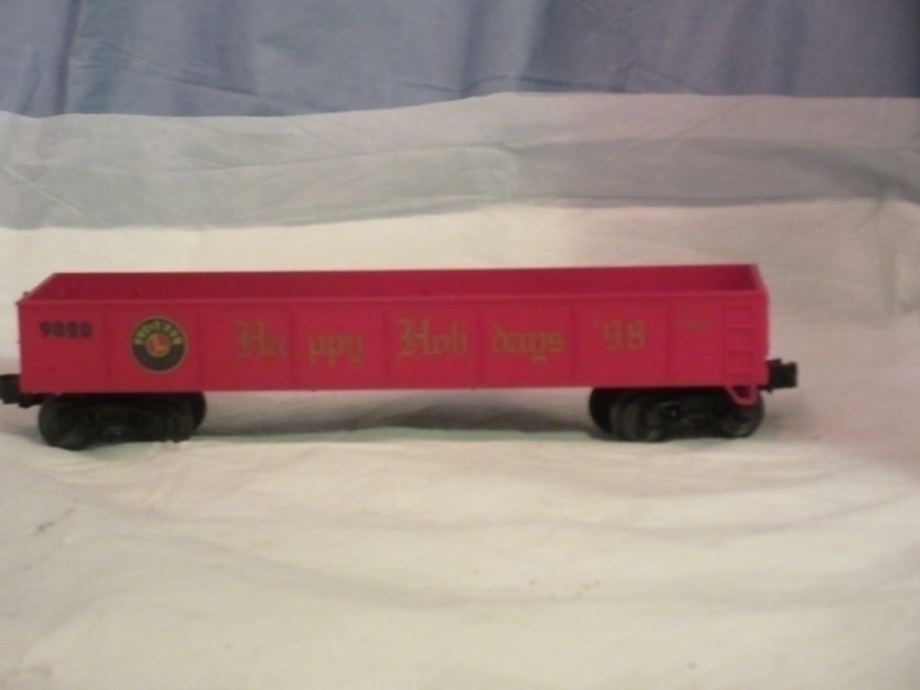 Lionel 9820 Christmas O Gauge Gondola: Lionel 9820 Christmas O gauge gondola car with real spring trucks.