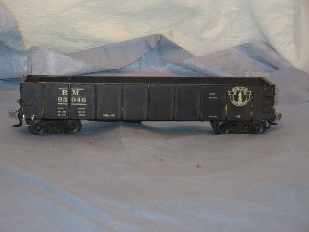 Wood BM 93046 O Scale Gondola: BM 93046 O scale gondola car. Wood construction, metal trucks and couplers.