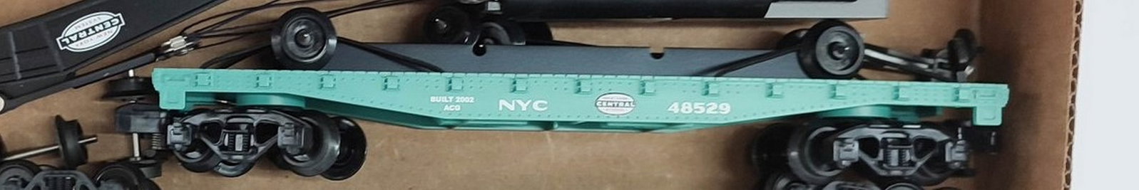 American Flyer NYC S Gauge Wheel Car: American Flyer New York Central S gauge wheel car with a wheel load.