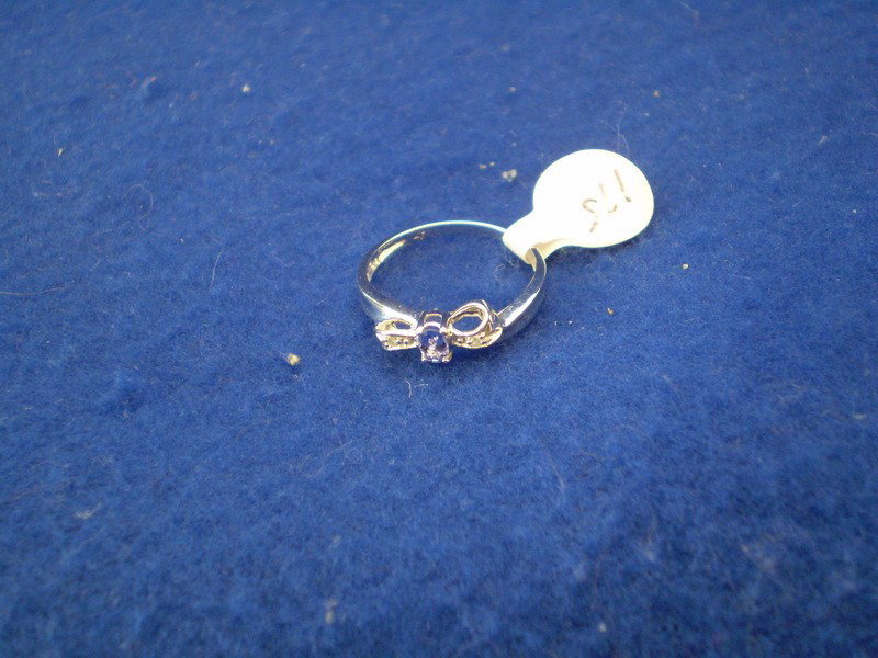 Tanzanite and Diamond Ring: 10k white gold tanzanite and diamond ring .25k, TW, Size 6.