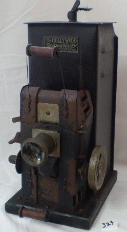 "The Hollywood" Toy Movie Projector : This toy Movie projector was manufactured for Montgomery Ward in the early 1900's. This projector is in good shape except back and cord missing.