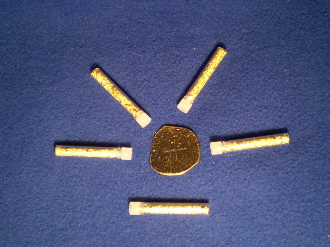 Pure Gold Vials and Pieces of Eight: 5 Two Inch Vials of Pure Gold Flakes and an ancient Pieces of Eight Coin Reproduction.