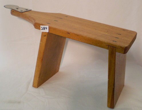 Your Guess is as Good as mine: It is a homemade watchamacallit. Back legs is shorter than front legs . Pointed stainless steel tip, may be for skining animals.