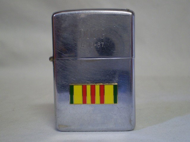 Vintage Vietnam Zippo: This Lighter has two different guys names & dates 1960's plus the Vietnam Ribbon.