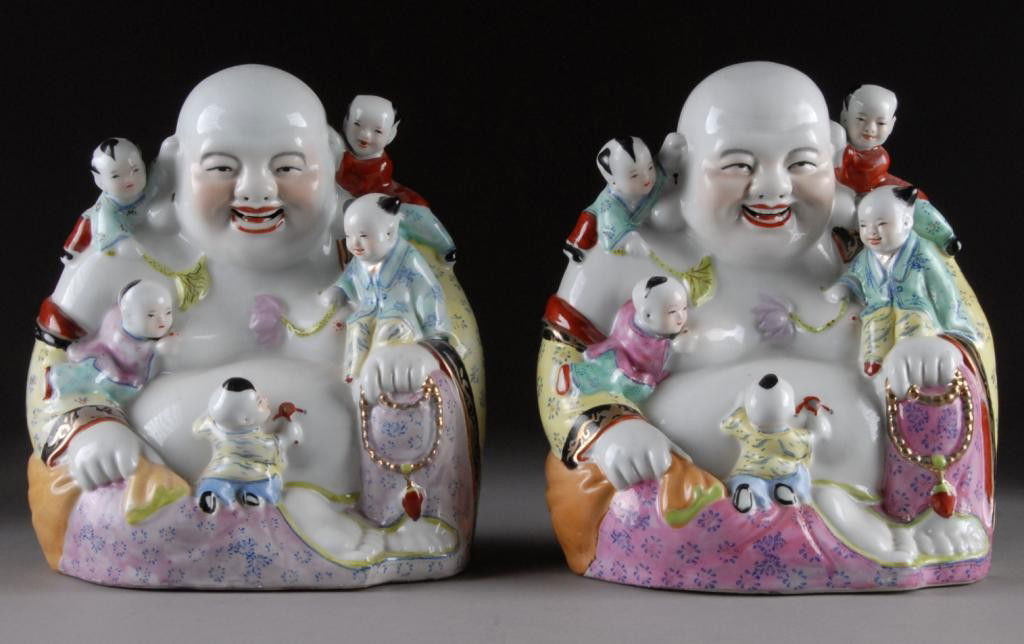A PAIR OF VINTAGE CHINESE FAMILLE ROSE PORCELAIN: LAUGHING BUDDHA AND CHILDREN, 20TH CENTURY, the corpulent smiling Buddha modeled in a seated royal repose position with loosely draped robes and playful children at carious pursuits coveringthe body.