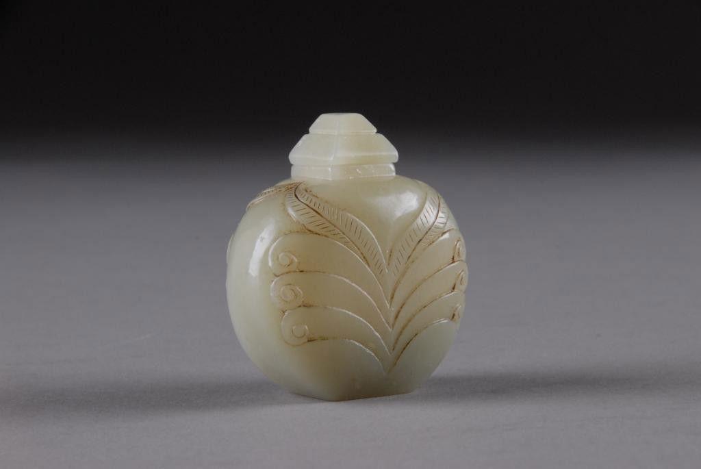A RARE AND FINELY CARVED CHINESE CELADON JADE: SCENT BOTTLE, 19TH CENTURY, designed for the Western market. Height: 2 1/2"