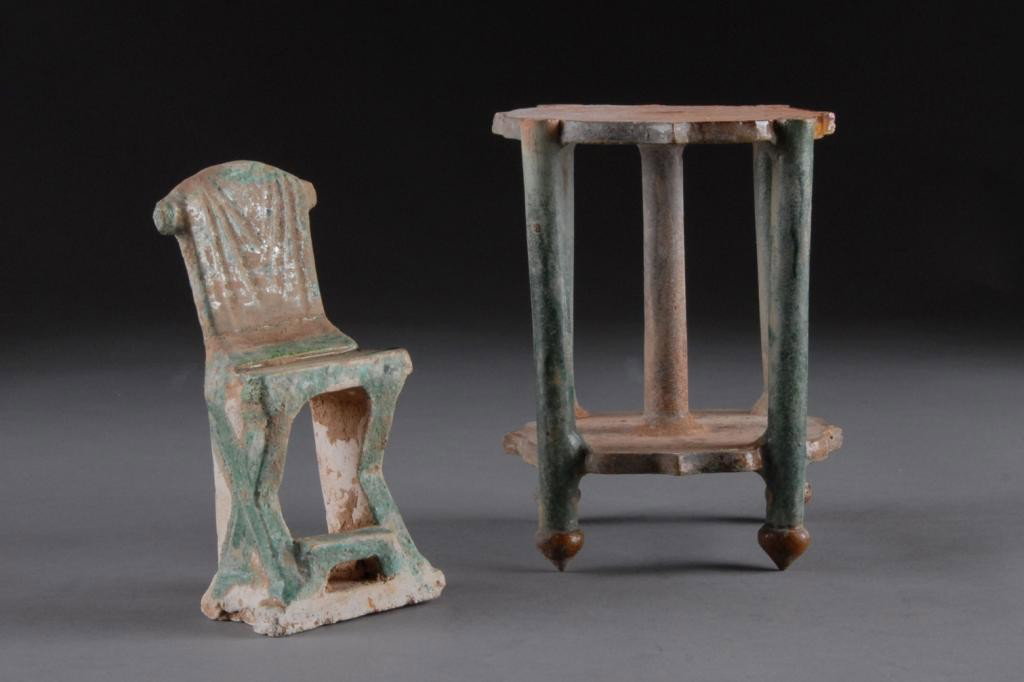 TWO CHINESE SANCAI GLAZED POTTERY,: comprising: an architectural barbed petal form stand raised on columnar supports ending in bud form feet connected by a conforming shelf, height: 6 1/4", 4 7/8" square; together with an "X" frame chai