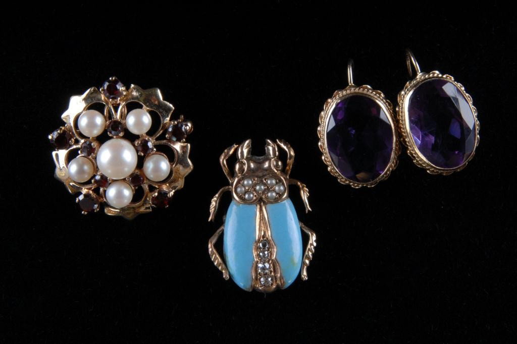 TWO PINS AND A PAIR OF EARRINGS: A 10K yellow gold beetle pin with turquois enamel, 4 diamonds = .12 Ct. and 7 seed pearls. Clasp repaired. A 1 " in diameter circle style pin in yellow gold with a concealable pendant loop set with 9 