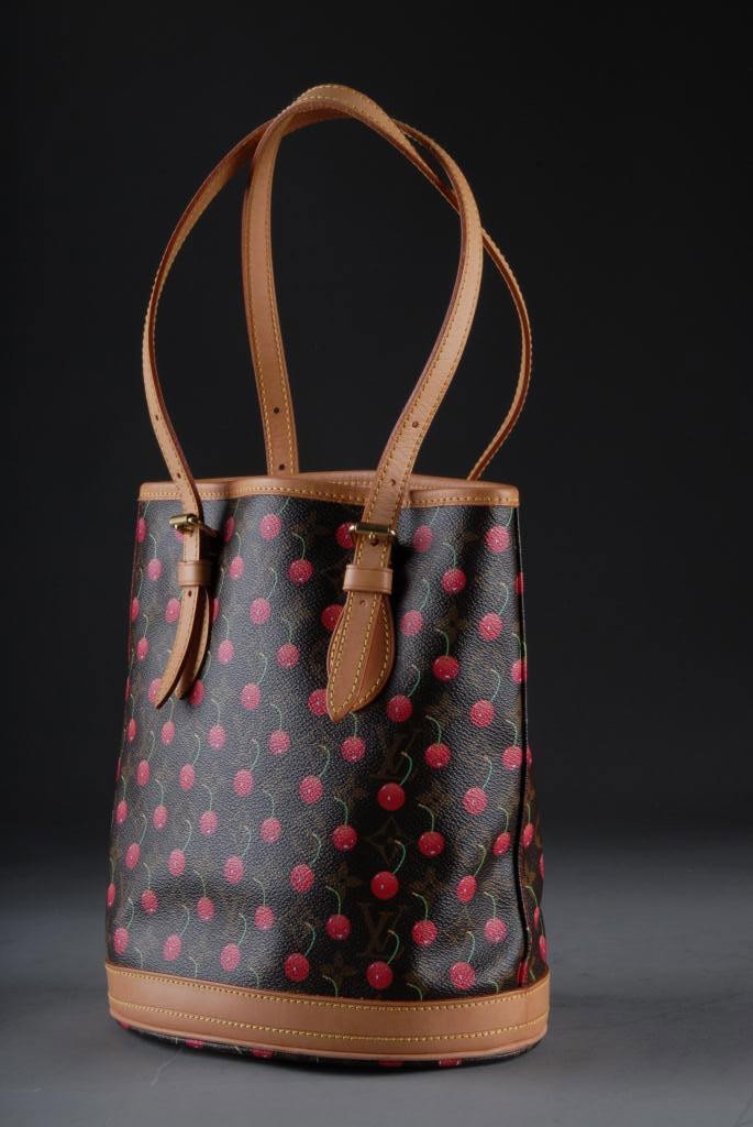 A LOUIS VUITTON LIMITED EDITION CHERISES CANVAS: BUCKET BAG, 2005 The exterior constructed of canvas in the Cherises pattern designed by Japanese artist Takashi Murakami as an on-going collaboration with Louis Vuitton, re-imagining the company's sig
