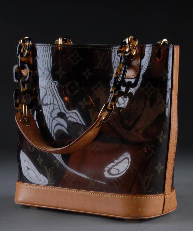 A LOUIS VUITTON LIMITED EDITION MONOGRAM TOTE: SAC SAMBRE PM, 2002 Part of a limited edition released in 2003, this tote is of vinyl structure with the clasic LV monogram pattern throughout, with natural leather trim, padded leather and tortoise-s