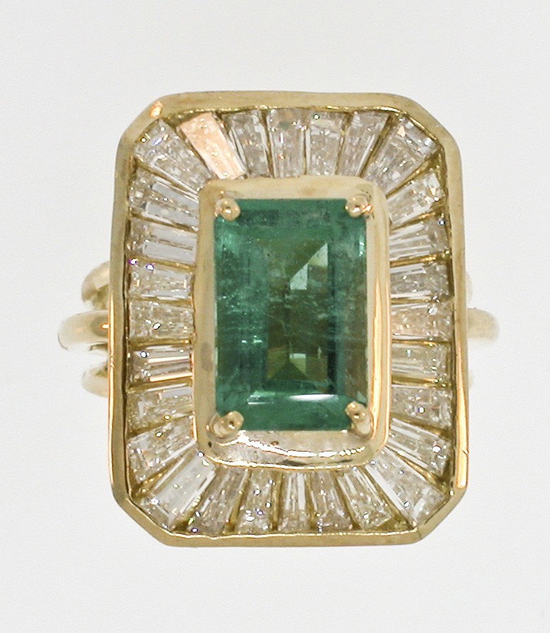 A MAGNIFICENT 14K EMERALD & DIAMOND RING: A ring/pendant combination in yellow gold containing one emerald = 3.00 Ct., measuring 6.6 x 10.1 millimeters, GIA Colored Stone Grading System – Clarity Type II, VVS and surrounded by 28 baguette c