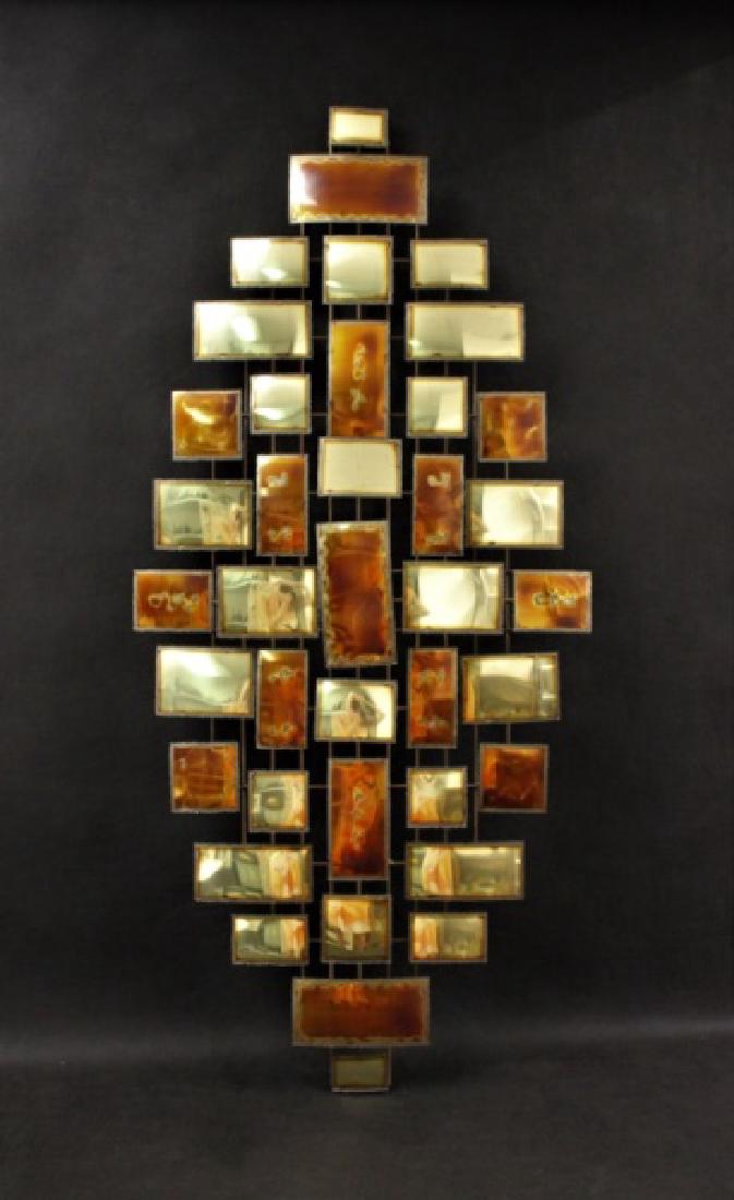 After Jere MCM Geometric Brass Wall Sculpture: After Curtis Jere 2- toned (brass and copper) brass wall sculpture in abstract, geometric raindrop form. Excellent condition. Measures 50.5" x 22".