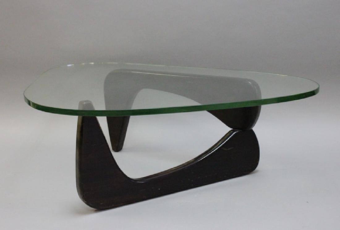 Vintage Noguchi Design Wood & Glass Coffee Table: Vintage Isamu Noguchi design amoeba form ebonized walnut coffee table base with thick green glass top. Believed to be manufactured by Modernica. Excellent condition with minor wear to stain and glass