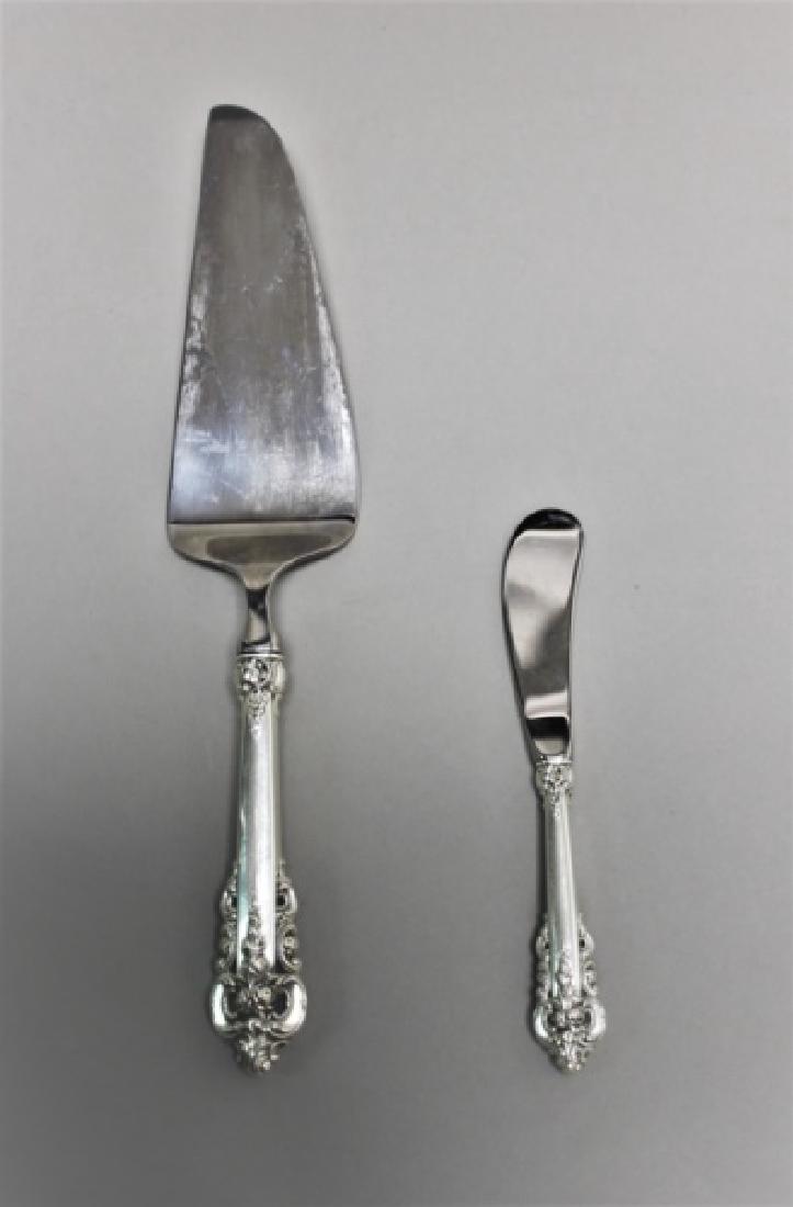Wallace Sterling Silver Cake Server & Butter Knife: (2) Pieces Wallace Silversmiths "Grand Baroque" pattern sterling silver handled serving utensils include: (1) Cake or pastry server (measures 11") and (1) butter spreader (measures 6"). New, never use