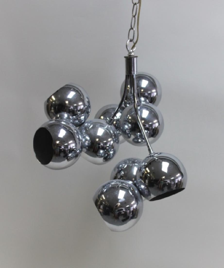 MCM Lightolier Polished Chrome 9-Lite Chandelier: Mid Century Modern Lightolier polished chrome chandelier. 9 round bulbs protrude from spherical chrome shades (non-adjustable) in 3 clusters of 3. Very good condition (chrome shows pitting, see photos