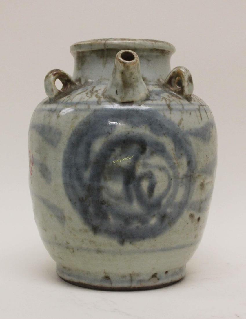 Ming Dynasty Blue & White Oil Or Wine Vessel: Ming Dynasty blue and white oil or wine vessel. Chinese glazed porcelain vessel has an open top with a spout and four loop handles, decorated on two sides with a circular emblem joined by a wave desig