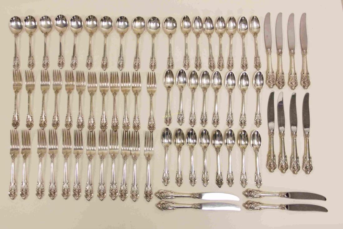 70 Pc Wallace Grande Baroque Sterling Flatware Set: (70) Piece Wallace "Grande Baroque" sterling silver flatware set . 5-piece service for 12 includes: (12) 7.5" dinner forks, (23) 6.15" teaspoons, (12) 6.5" salad forks, (11) 6.15" Cream soup spoons, a