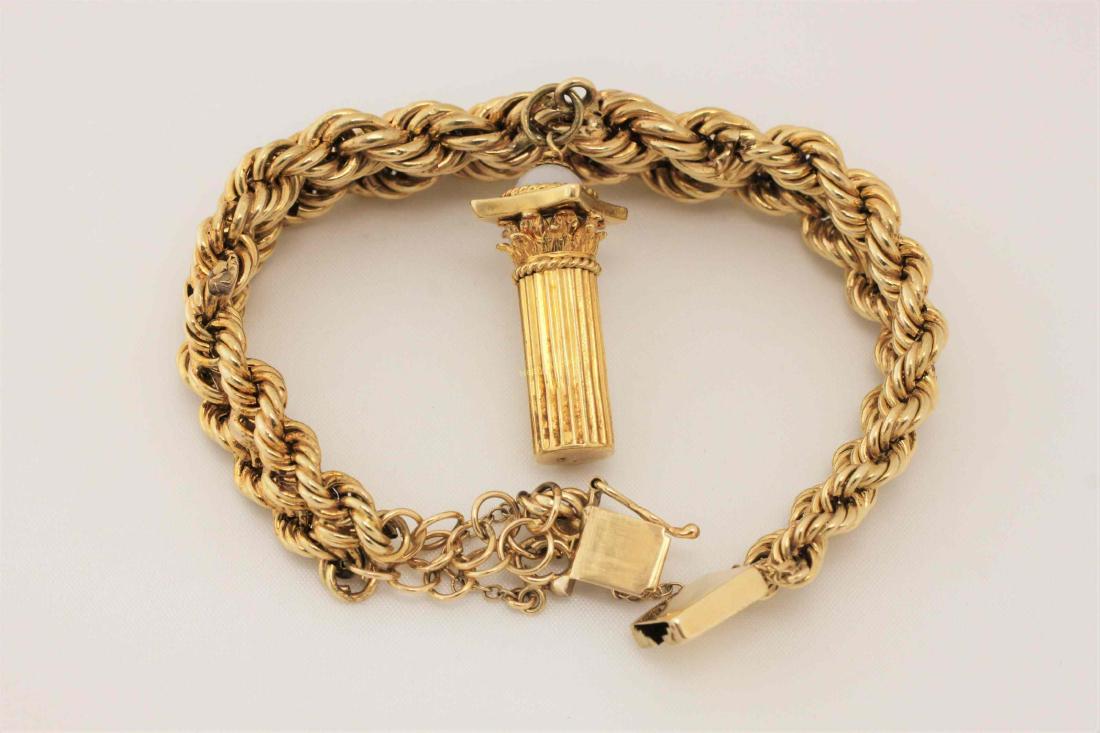 14k Italian Gold Charm Bracelet w 18k Roman Charm: 14k Italian gold charm bracelet with a 18k Roman column and moonstone charm. Excellent condition. Bracelet measures 7.5" x .5" x .25". Total weight = 31.9 g or 1.025 troy oz. ***All silver, gold and j