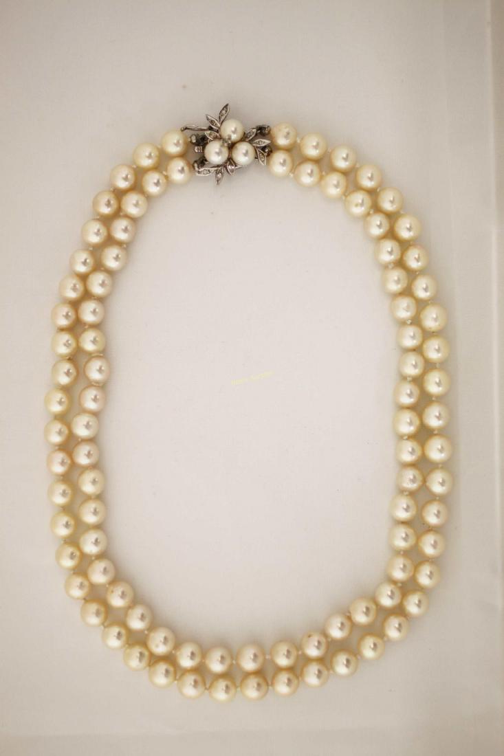(91) 8mm Pearl Necklace w 14k Gold Clasp: Double stranded pearl necklace or choker containing (91) 8 mm pearls. Floral design clasp is 14k gold with melee diamonds and a three pearl cluster. Measures 15.5". ***All silver, gold and jewelry pur