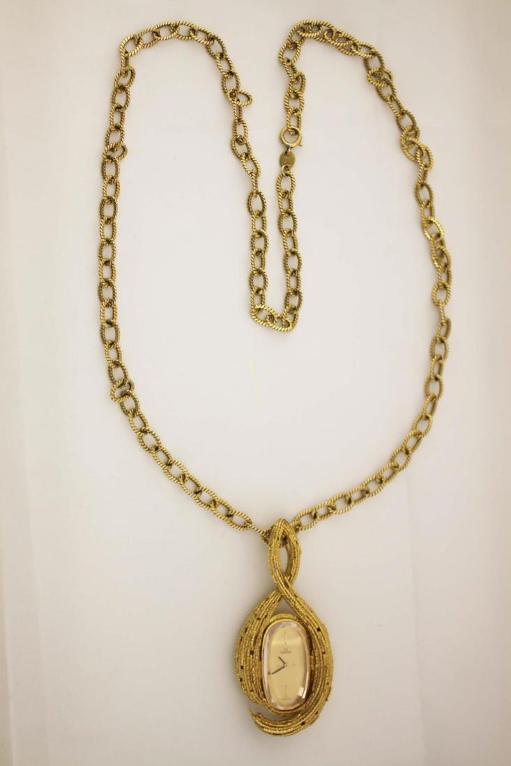 70's Omega & Andrew Grima Design 18K Pendant Watch: 1970's Ladies 18K Omega Modernist pendant watch with a 14k gold chain. Designed by Andrew Grima for Omega's "About Time" collection. Excellent working condition. Total Chain Weight = 35.8 g or 1.16 tr