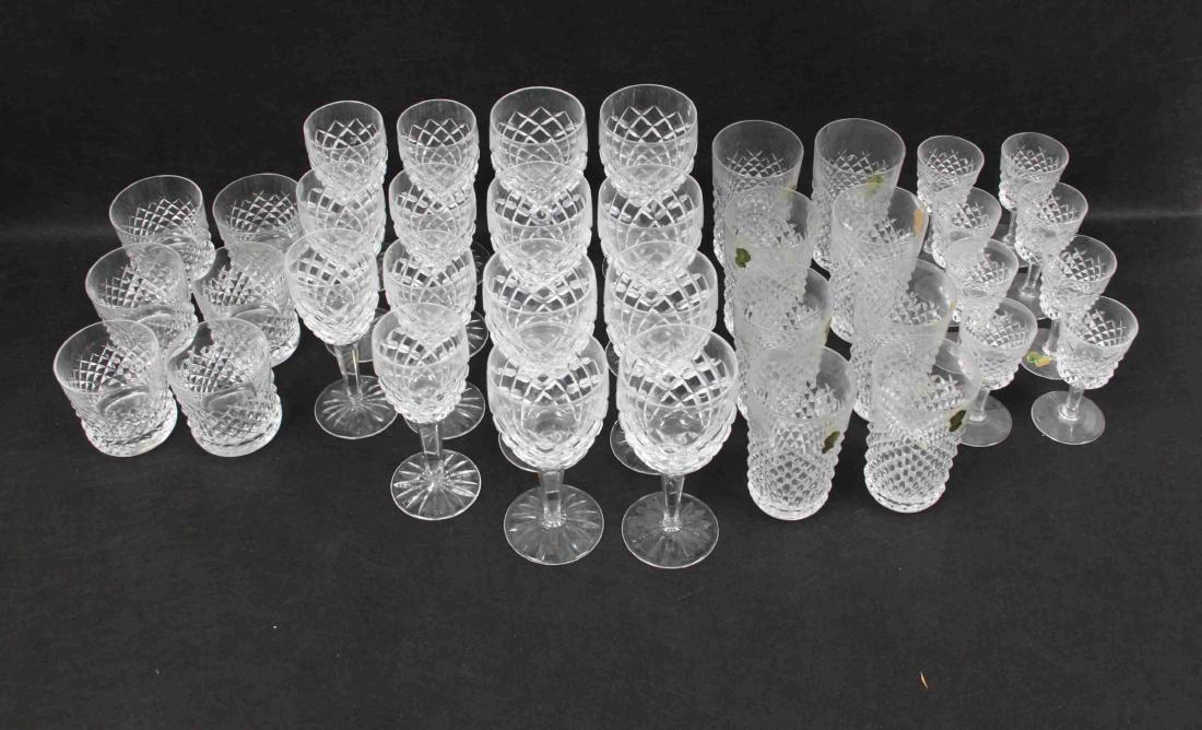 36 pc Waterford Comeragh Crystal Stemware Tumblers: (36) Pieces of Waterford "Comeragh" pattern crystal stemware and tumblers in excellent condition (many with original Waterford labels still adhered. Includes: (8) Wine glasses (measure 7" tall, each),